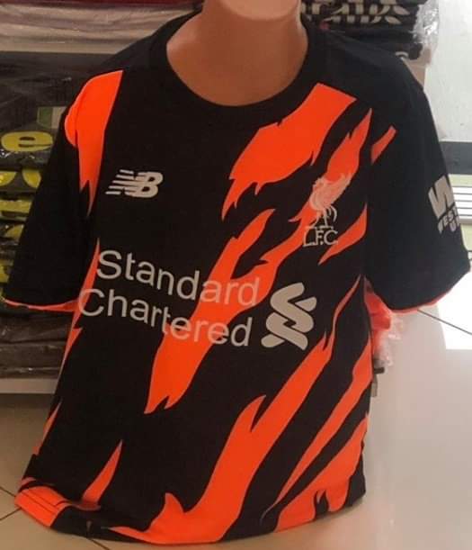 Liverpool black and store orange kit